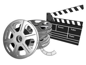 Filmspule und Filmklappe schwarz weiß zum Thema Videos